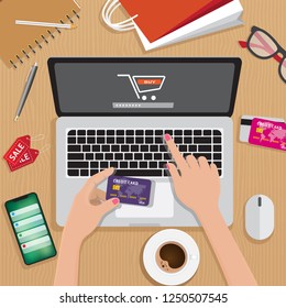Online shopping, e-payment, retail and delivery concept, laptop with shopping cart at center