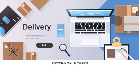 online shopping express shipping delivery service concept top angle view desktop laptop smartphone cardboard parcel box office stuff horizontal copy space
