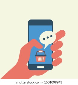 Online shopping with hand holing smart phone with buy button on the screen.