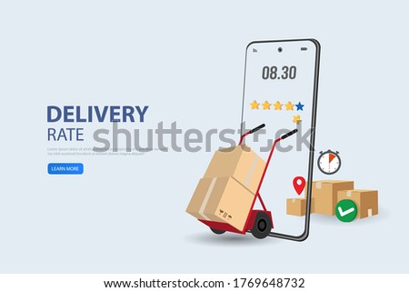 Online shopping or mobile shopping app concept, young man consumer holding credit cart pushing full of goods and box packages in shopping cart trolley running from website or app on mobile smart phone