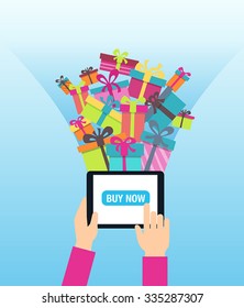 Online shopping - ordering gifts online. A person using modern technology - touch screen tablet for Christmas shopping.