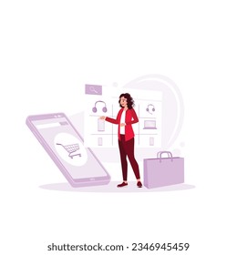 online shopping shop on a smartphone screen held by a woman. Online shopping store with a cell phone. Trend Modern vector flat illustration.