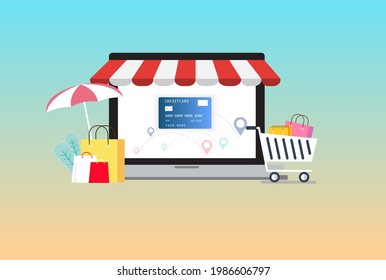 Online store concept on laptop screen by credit card with striped awning and paper bag.