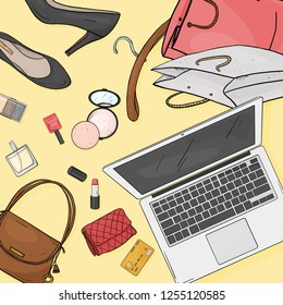 Online store desktop concept with laptop, Desk, bags, credit cards, cosmetics and shoes. Credit card payment. The view from the top.