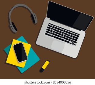 online training with a computer, phone, headphones and notebooks