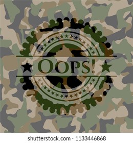 Oops! written on a camouflage texture
