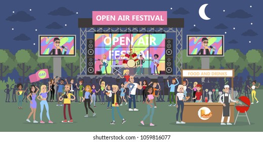 Open air festival at night with people and musicians.