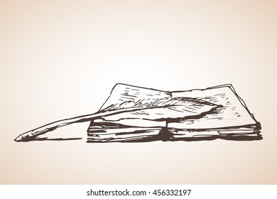 Open book with feather pen. Isolated on white background