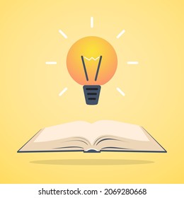 Abrir libro con bombilla sobre él