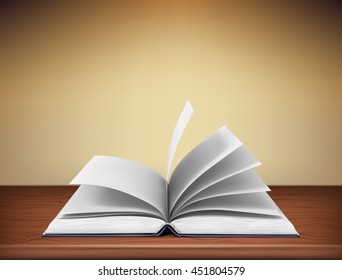 open book lying on a wooden table