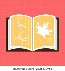 Open book with a maple leaf and the inscription back to school.