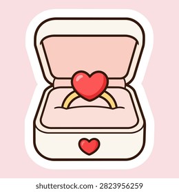Open cream and pink ring box holding a gold ring with a red heart-shaped stone, surrounded by a white sticker border on a pale pink background.