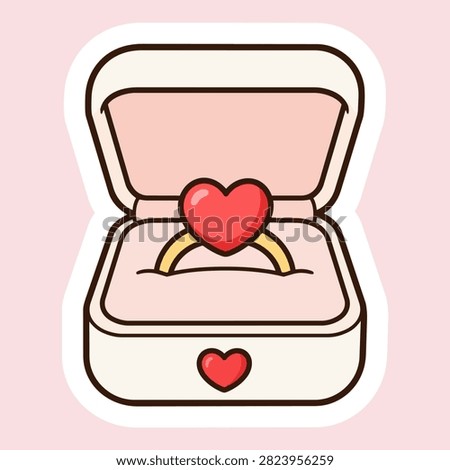 Open cream and pink ring box holding a gold ring with a red heart-shaped stone, surrounded by a white sticker border on a pale pink background.