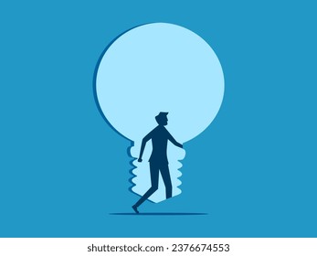 Open the door to new knowledge. Businessman steps into the light bulb door 
