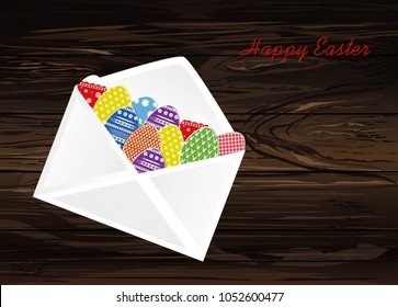 Open envelope with Easter colored eggs with a pattern.  Greeting card for the holiday. Vector illustration on wooden background.