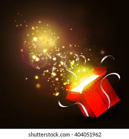 Open gift box with bright rays of light 