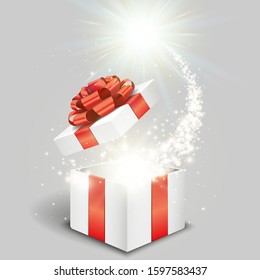 Open gift box and magical light