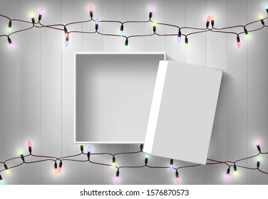 Open Gift Box  On Wood Background With Fancy Light