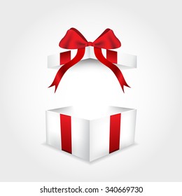 Open gift box with red ribbon