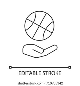 Open hand with basketball ball linear icon. Sport goods store. Contour symbol. Vector isolated outline drawing. Editable stroke