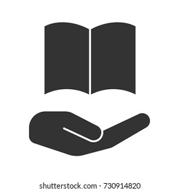 Open hand with book glyph icon. Library. Silhouette symbol. Free e-books. Negative space. Vector isolated illustration