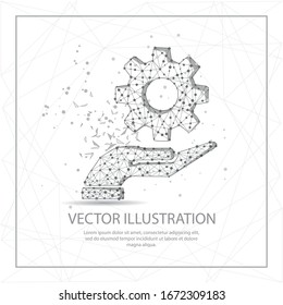 Open hand with cogwheel digitally drawn in the form of broken a part triangle shape and scattered dots low poly wire frame.