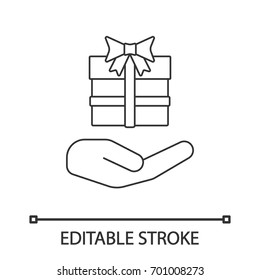 Open hand with gift box linear icon. Present. Thin line illustration. Giving, getting gift. Contour symbol. Vector isolated outline drawing. Editable stroke