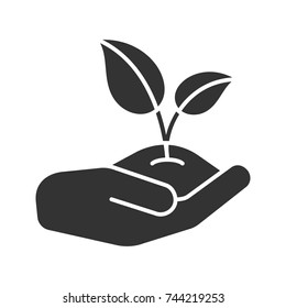 Open hand with sprout glyph icon. Environment protection. Agriculture. Silhouette symbol. Negative space. Vector isolated illustration