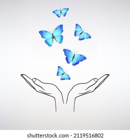 open hands release a flock of blue butterflies on a light background
