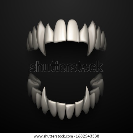 Open jaws with big fangs on black background