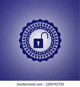 open lock icon inside emblem with jean background