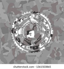 open lock icon inside grey camouflaged emblem