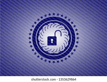 open lock icon inside jean or denim emblem or badge background