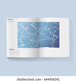 Open magazine book with water in the middle page