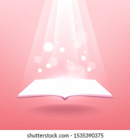 Open magic book with bright sparkling light rays.