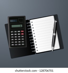 Open notebook, calculator and pen