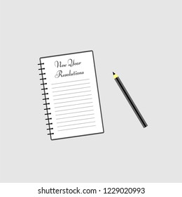Open notepad with new year resolutions ad a pencil