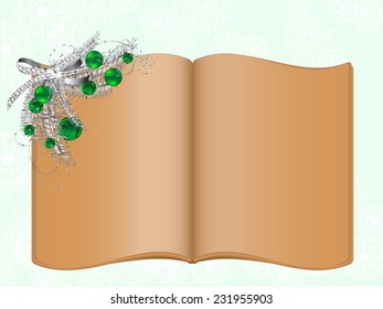 Open old book with silver christmas garland