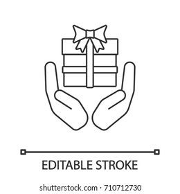 Open palms with gift box linear icon. Present. Thin line illustration. Contour symbol. Giving, getting gift. Vector isolated outline drawing. Editable stroke