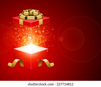 Open red gift box and golden bow open with magic light fireworks Christmas vector background.