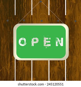 Open sign hanging on a wooden fence