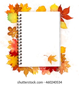 Open spiral notebook with autumn leaves vector background