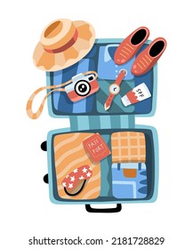 Open suitcase, getting ready for a trip. Packing luggage for vacation. Clothes, shoes, camera, sunglasses, hat, passport. For stickers, web design, social media and advertisement. Tourism day