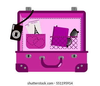 Open suitcase with things for romantic vacation