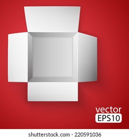 Open white box on red background. Top view. 