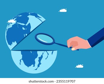 Open the world. Businessman using a magnifying glass to look at the world