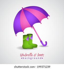 Opened bright umbrella and rain boots background
