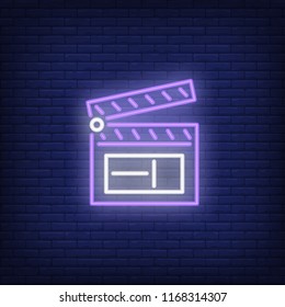 Opened clapper neon sign. Luminous signboard with clapperboard. Night bright advertisement. Vector illustration in neon style for commercial, video production, blogging