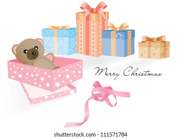 Opened gift with Teddy Bear inside and other unopened Christmas gifts on the white background and the untied ribbon