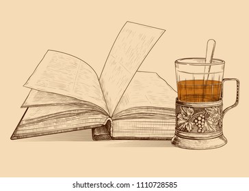 An opened old  book and tea in the cup holder.Hand-drawn vector drawing in vintage style. Sketch. Imitation of engraving.